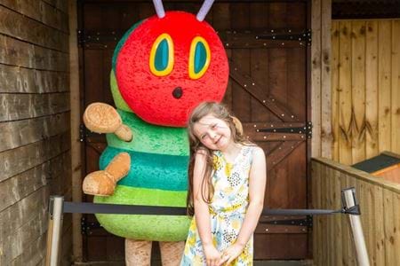 A series of images showcasing The Very Hungry Caterpillar at Gulliver's Theme Park Resorts